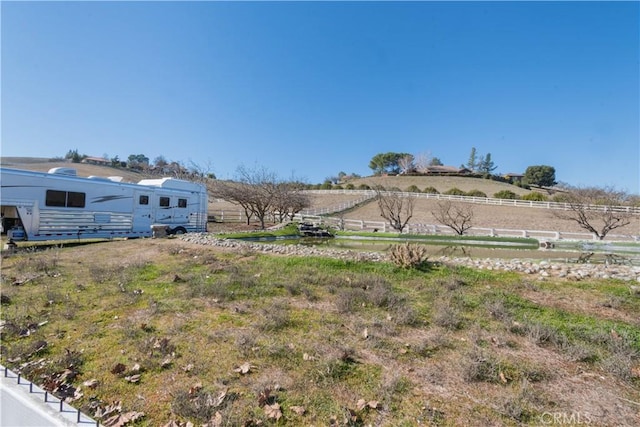 view of yard with a rural view