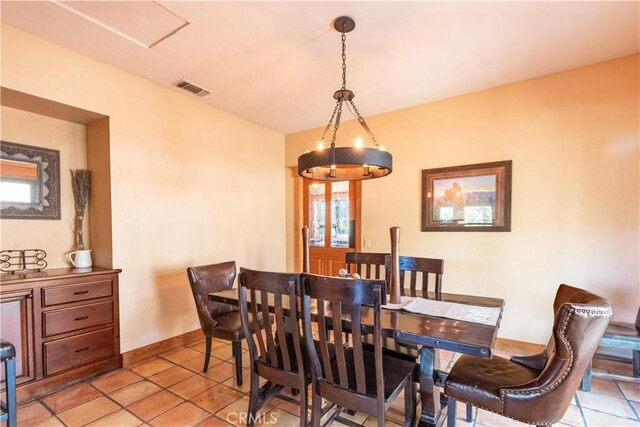 dining space with plenty of natural light and light tile patterned floors