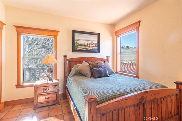 bedroom featuring light tile patterned floors