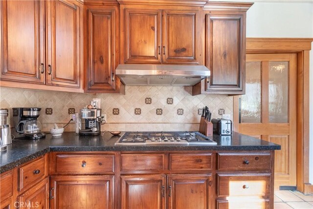 kitchen featuring tasteful backsplash and stainless steel gas cooktop