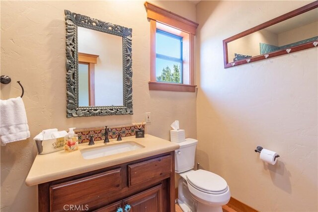 bathroom with vanity and toilet