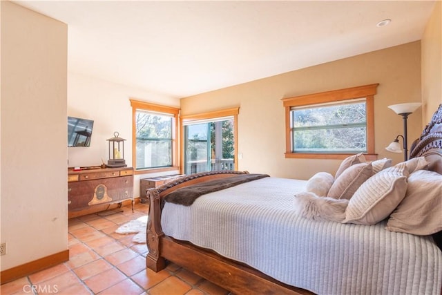 bedroom with light tile patterned floors