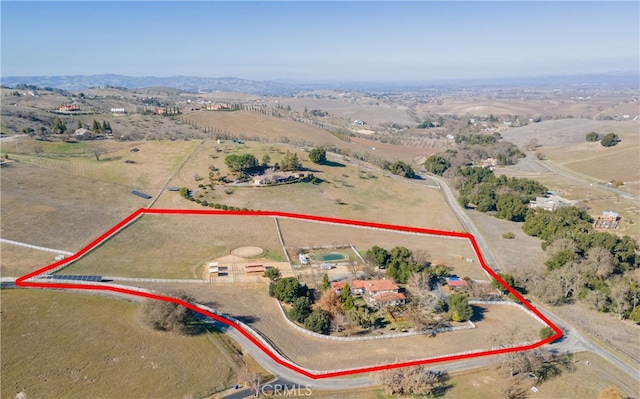 birds eye view of property featuring a rural view