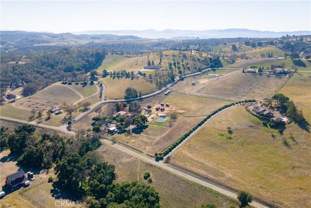 aerial view with a mountain view and a rural view