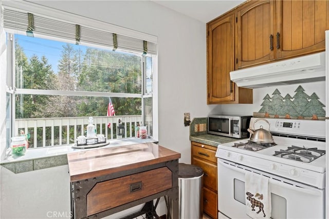 kitchen with white gas range