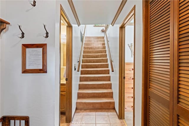 stairs featuring tile patterned floors