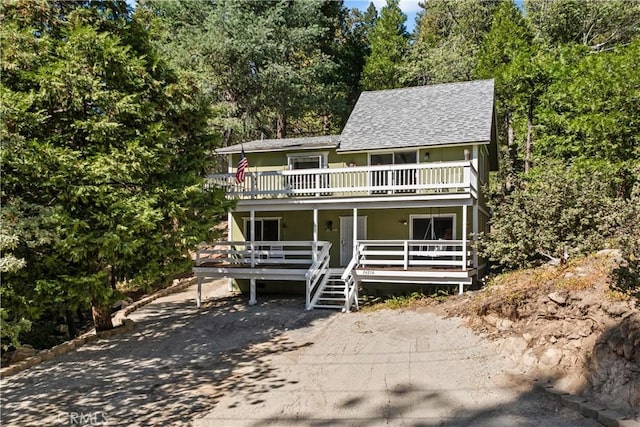 view of front of property with a balcony