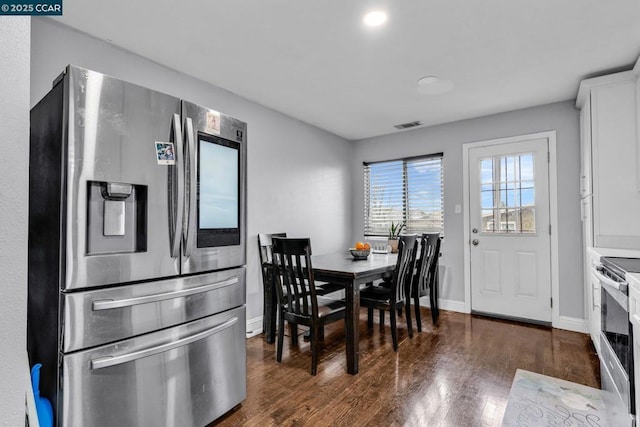 dining area with dark hardwood / wood-style floors