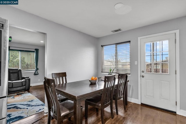 dining room with dark hardwood / wood-style floors