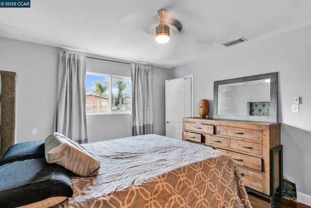 bedroom with dark hardwood / wood-style floors