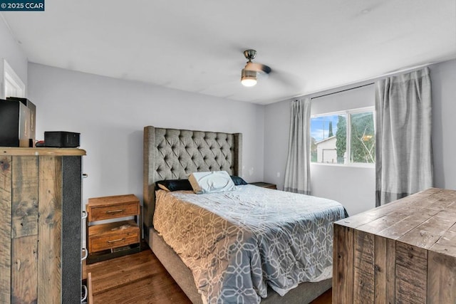 bedroom with dark wood-type flooring and ceiling fan