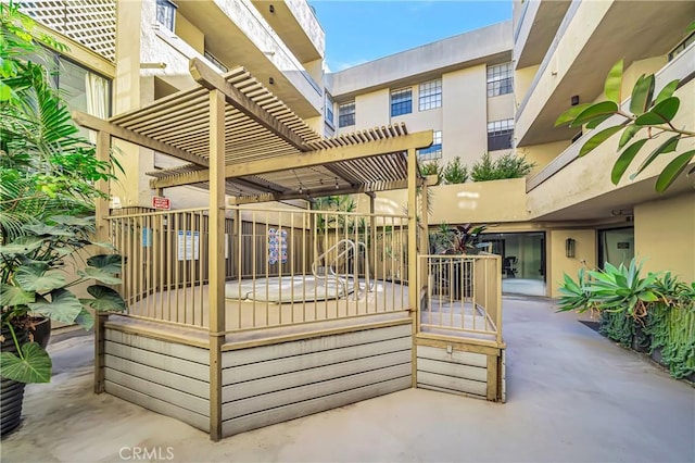 wooden terrace featuring a pergola