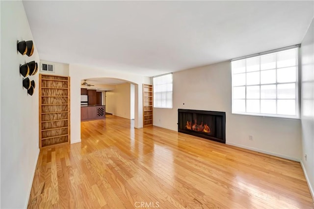 unfurnished living room featuring light wood-type flooring