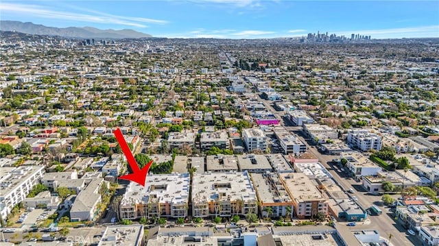 birds eye view of property featuring a mountain view