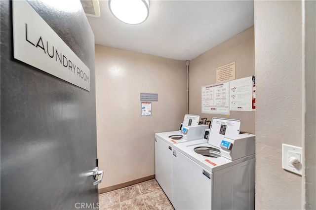 laundry area with washing machine and dryer