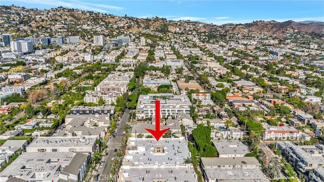 birds eye view of property with a mountain view