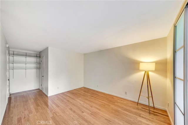 unfurnished room featuring light wood-type flooring