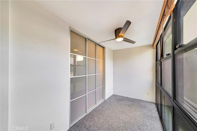 interior space with ceiling fan