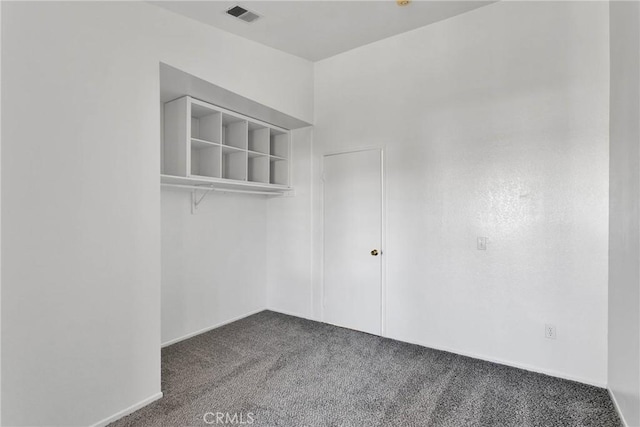 walk in closet featuring carpet