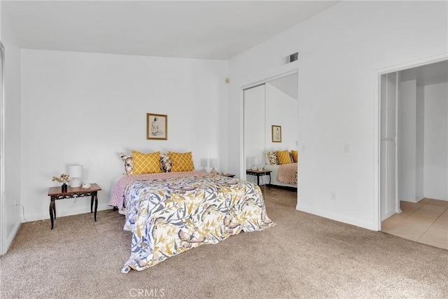 carpeted bedroom featuring a closet