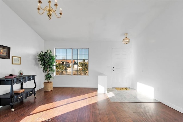 entrance foyer featuring wood-type flooring and a chandelier