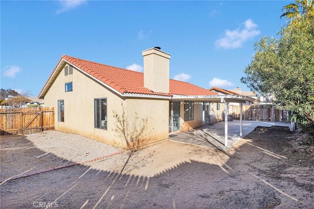 back of property with a patio area