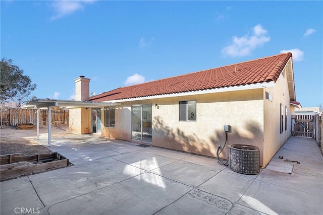 rear view of property featuring a patio area