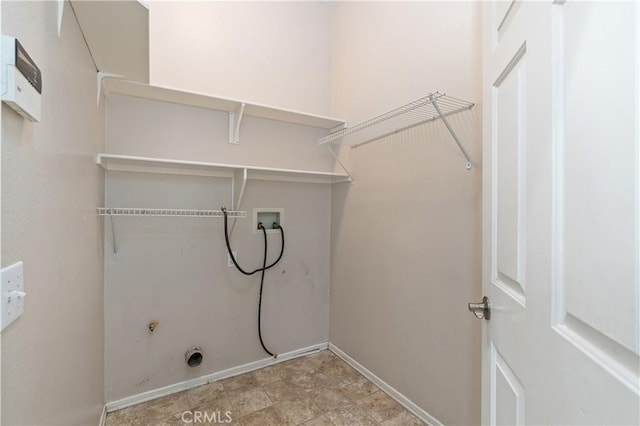 clothes washing area featuring hookup for a washing machine and electric dryer hookup