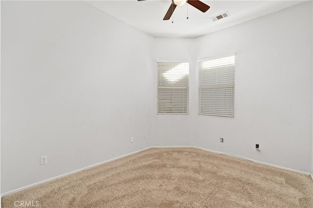 carpeted empty room with ceiling fan