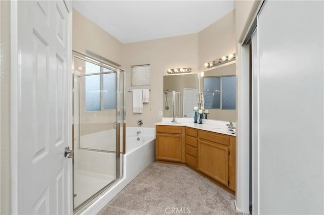 bathroom featuring vanity and separate shower and tub