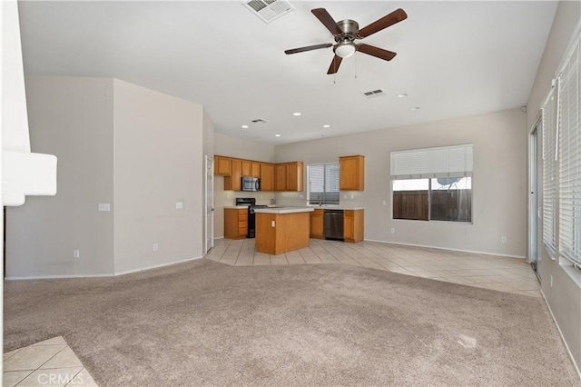 unfurnished living room with light colored carpet and ceiling fan