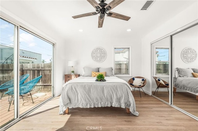 bedroom with access to exterior, ceiling fan, and light hardwood / wood-style flooring