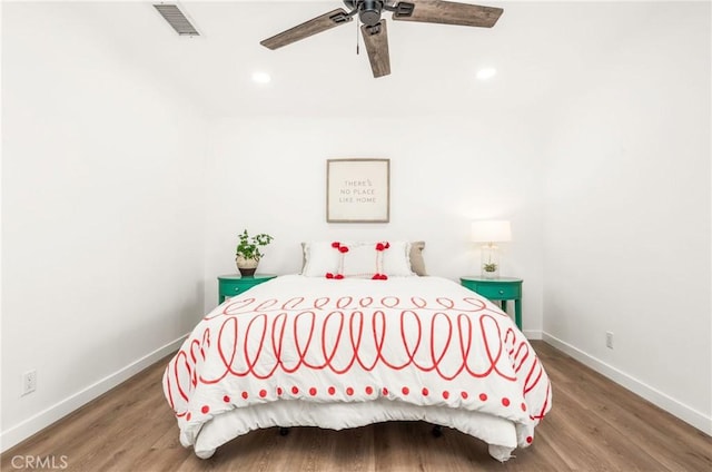 bedroom featuring wood-type flooring and ceiling fan