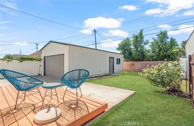 view of outbuilding with a garage and a lawn