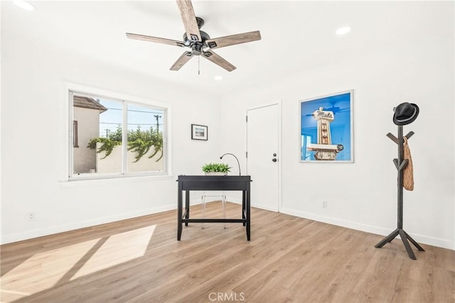 interior space with light hardwood / wood-style flooring and ceiling fan