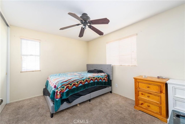 carpeted bedroom featuring ceiling fan