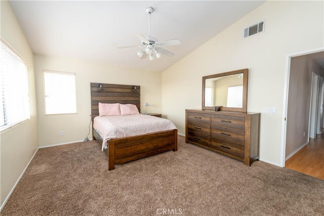 bedroom featuring carpet floors, vaulted ceiling, and ceiling fan