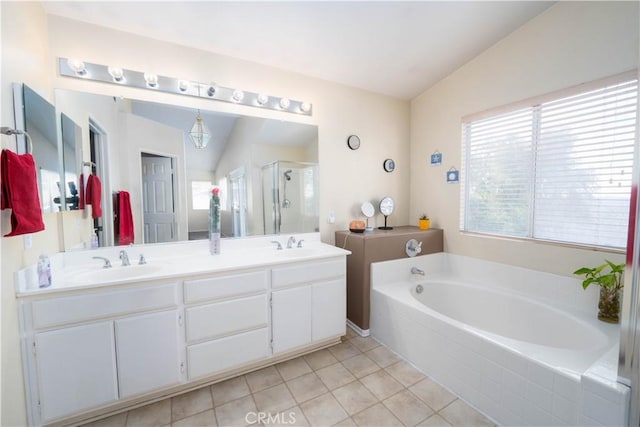 bathroom featuring shower with separate bathtub, lofted ceiling, tile patterned floors, and vanity