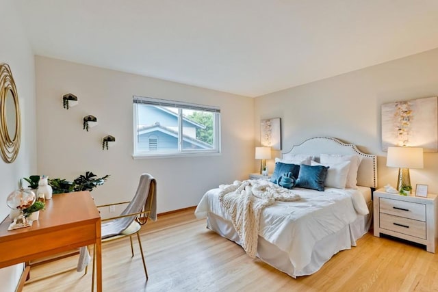 bedroom with light wood-type flooring