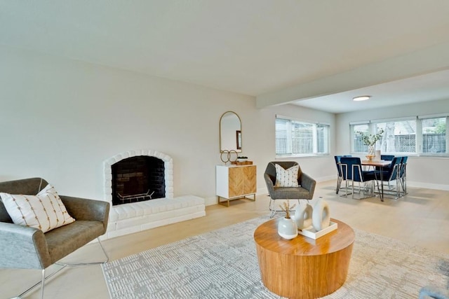 living room featuring light hardwood / wood-style flooring and a fireplace