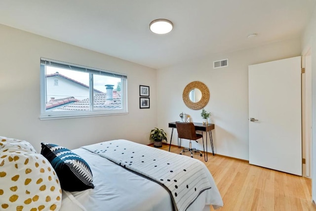 bedroom featuring light wood-type flooring