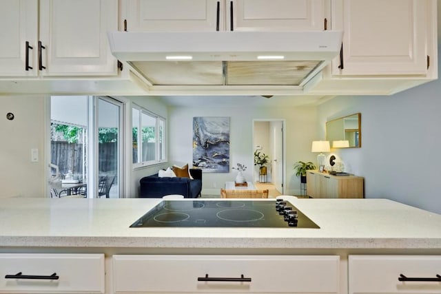 kitchen featuring white cabinetry and black electric stovetop