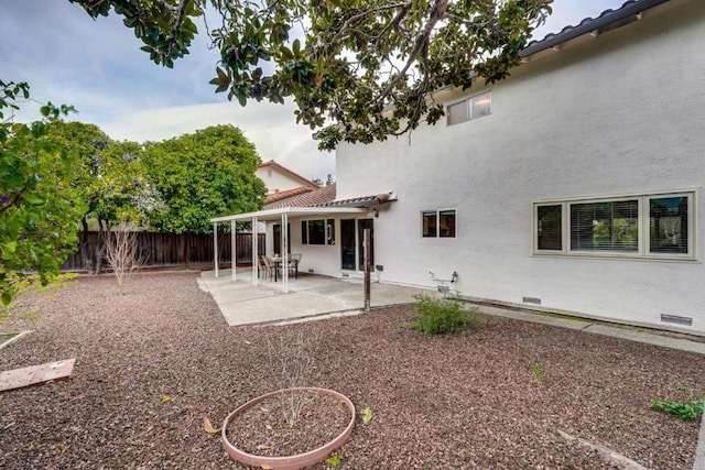 rear view of property featuring a patio area