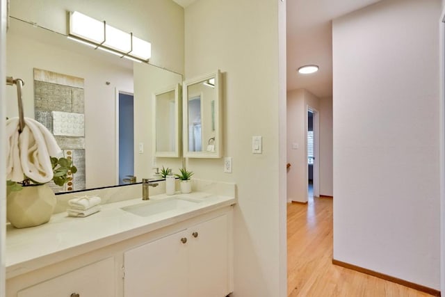 bathroom with vanity and hardwood / wood-style flooring