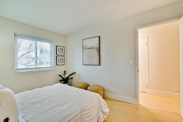 bedroom with light wood-type flooring