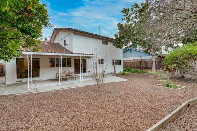 back of property featuring a patio