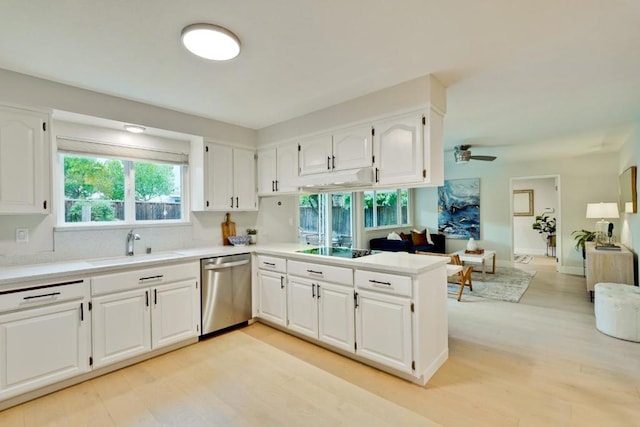 kitchen featuring white cabinetry, dishwasher, black electric stovetop, kitchen peninsula, and light wood-type flooring