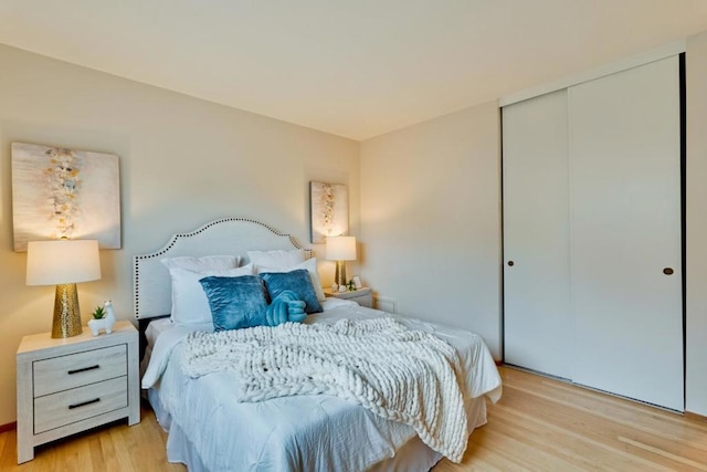 bedroom featuring light hardwood / wood-style flooring and a closet