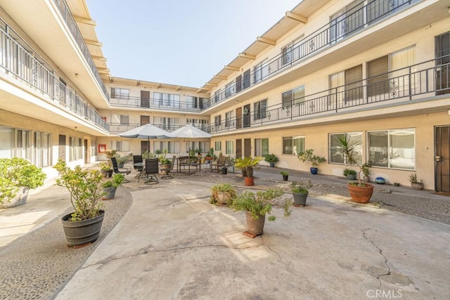 view of property's community with a patio area