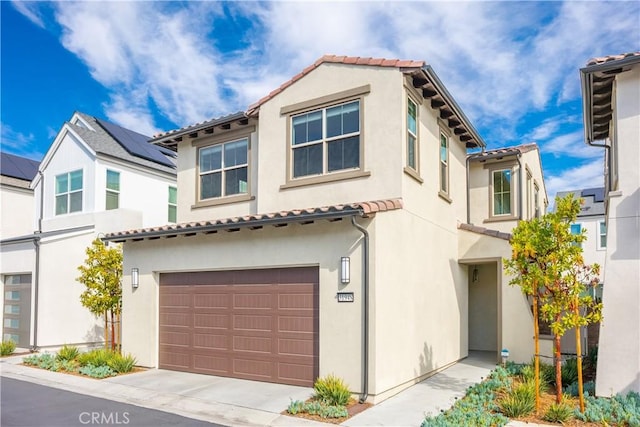 mediterranean / spanish-style house featuring a garage